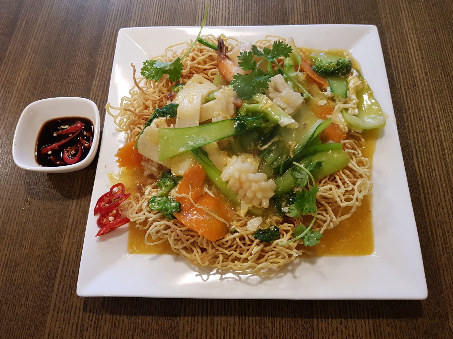 Stir fried seafood and vegetables with crispy noodles